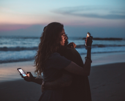 Couple isolates each other by looking at their phones