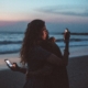 Couple isolates each other by looking at their phones