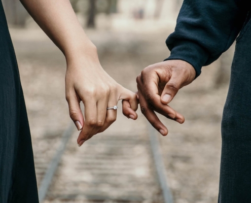 Successful couple holding hands